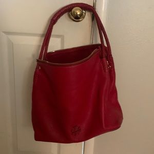 This is a red Tory Burch red purse. Genuine leather